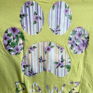 Floral PAWZ logo on yellow tee